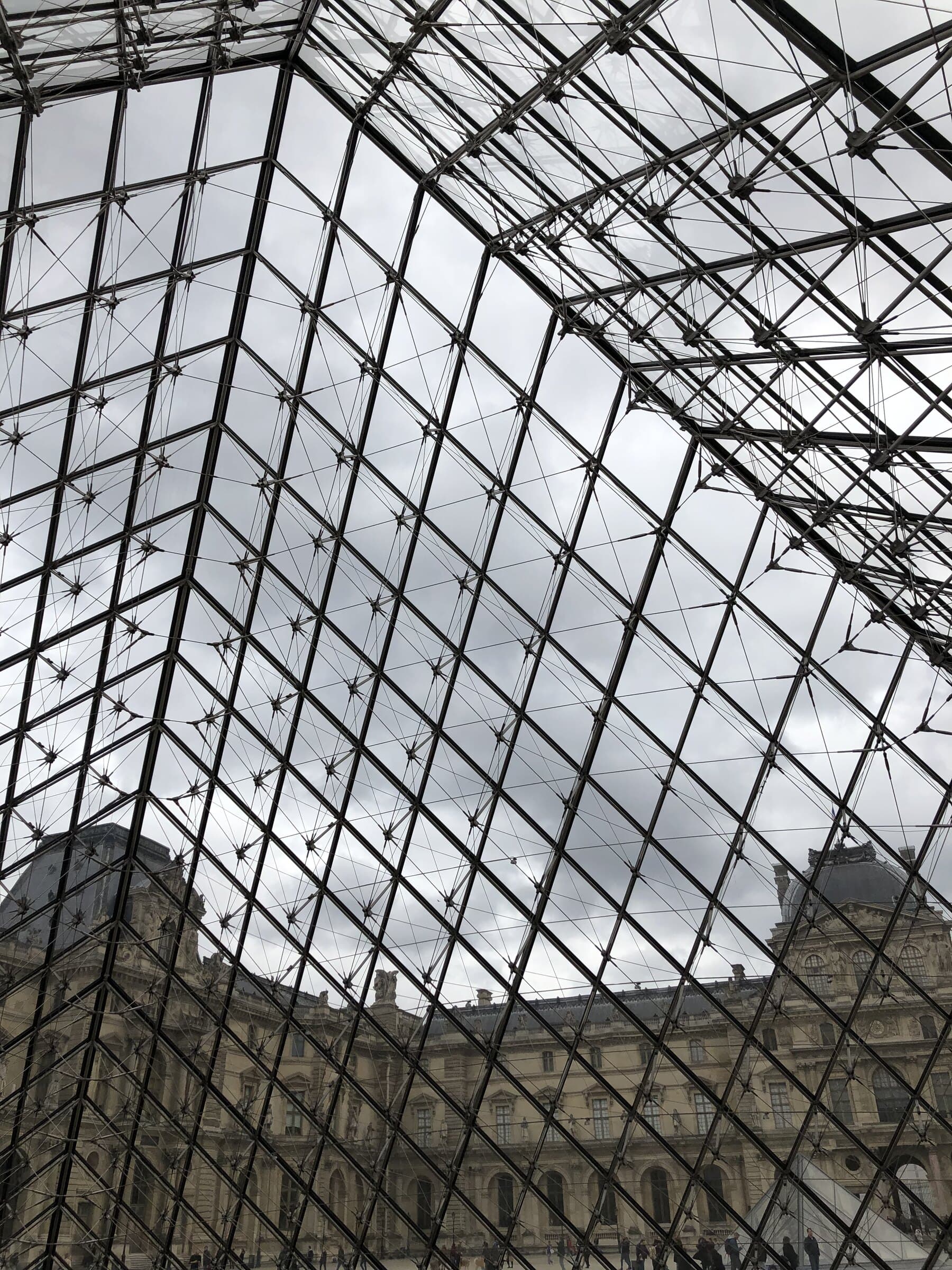 Louvre pyramid lattice texture in Paris.