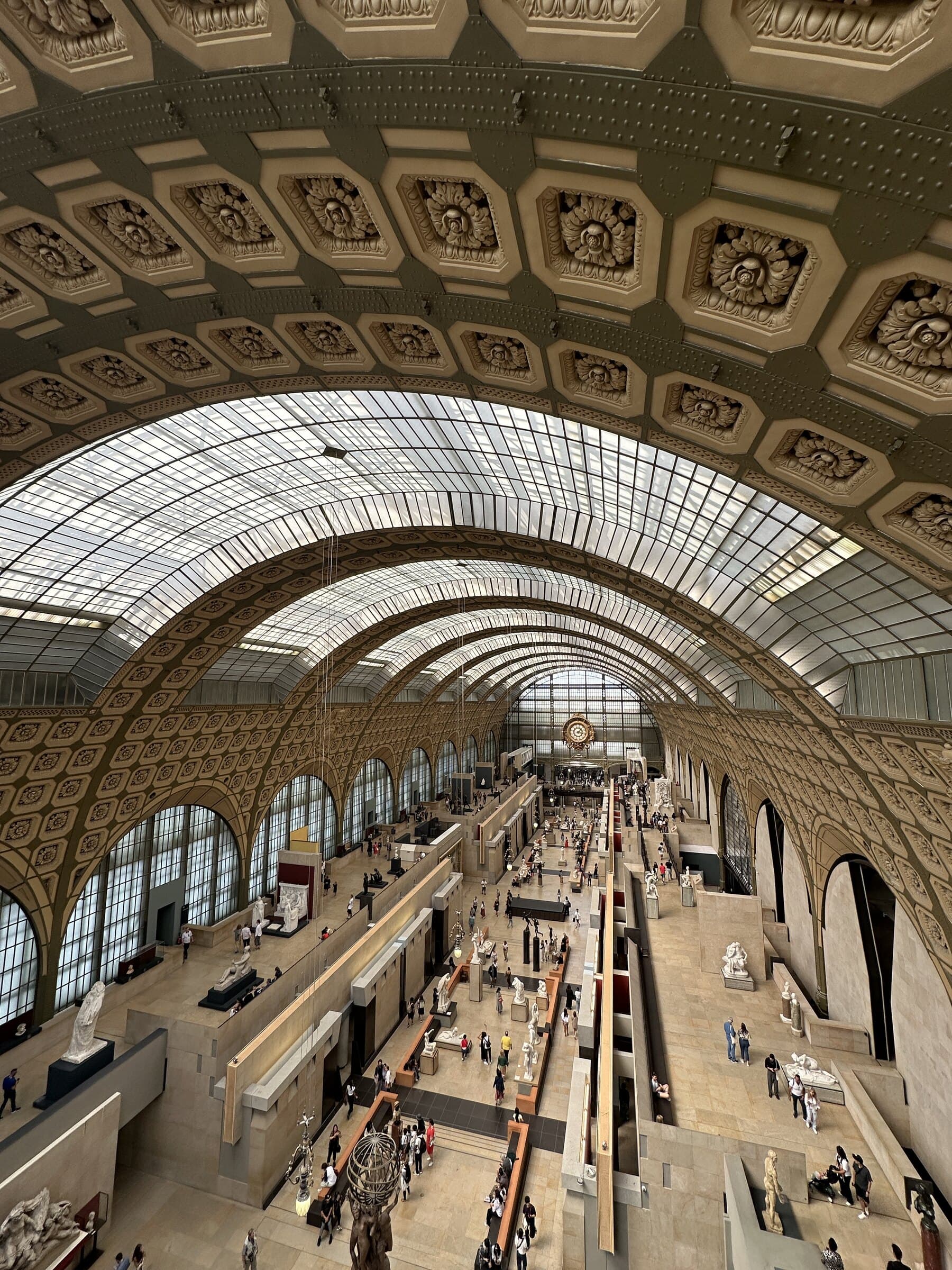 Grand Paris museum hall beneath a vaulted roof.